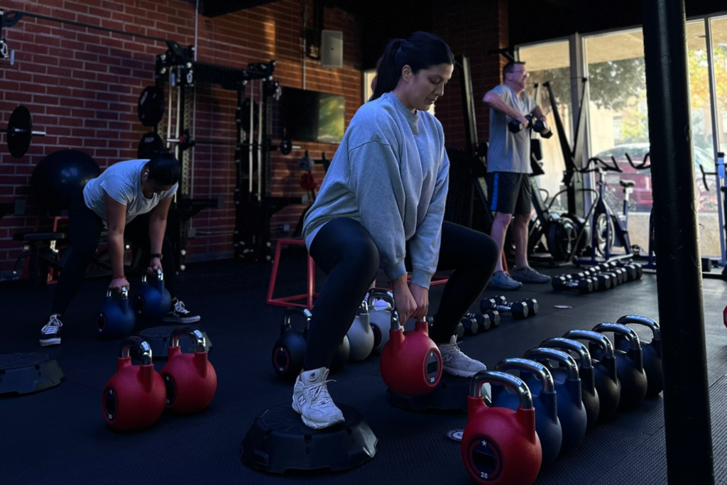 Members participating in group fitness classes in Thousand Oaks at Flex45 during a high-energy HIIT workout