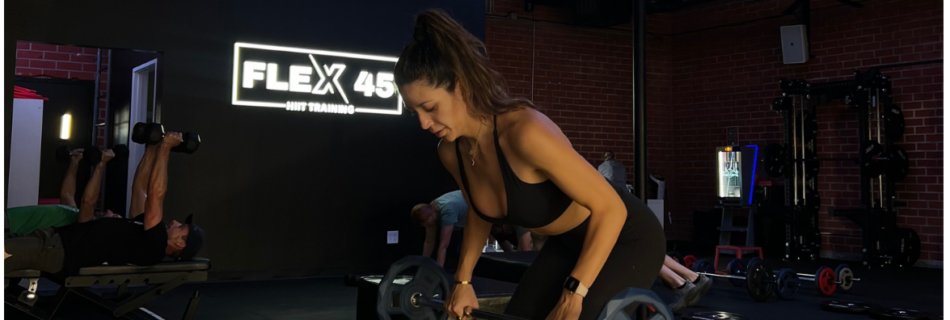 Woman performing strength training in a coach-led fitness class in Thousand Oaks