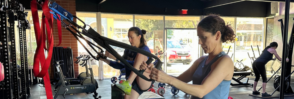 Woman performing strength training in a coach-led class in Thousand Oaks