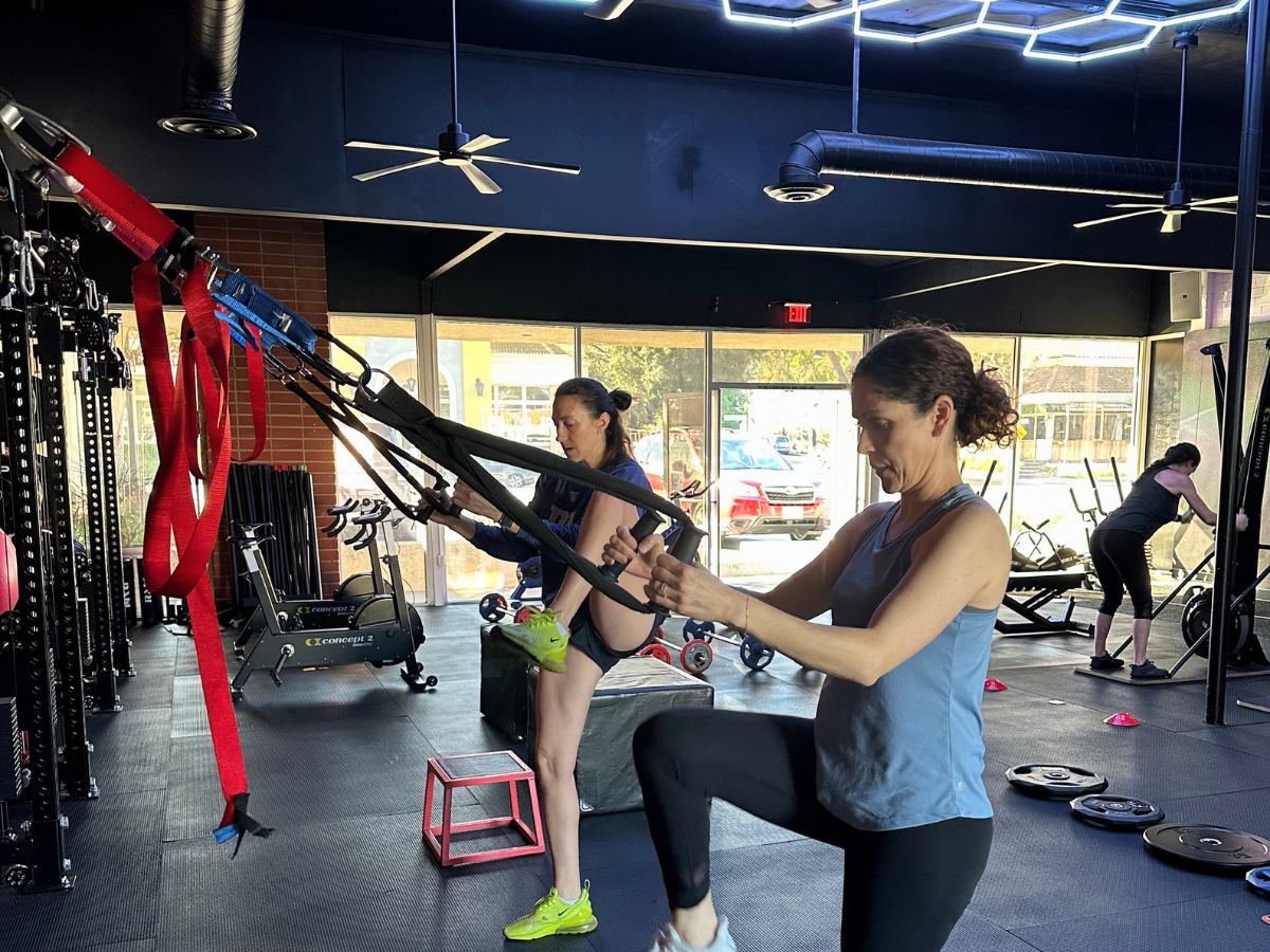 Woman performing strength training in a coach-led class in Thousand Oaks