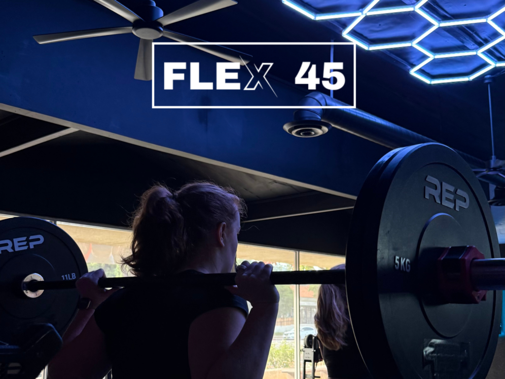 Coach leading a small group workout at a boutique fitness studio in Thousand Oaks