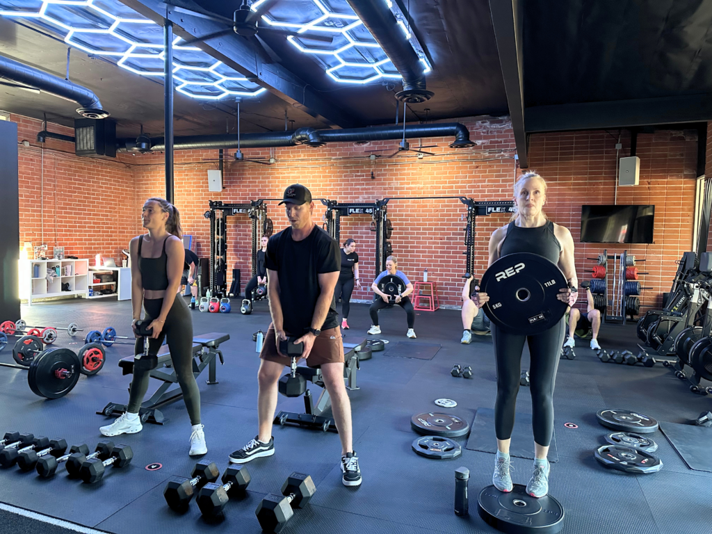 Coach-led group workout at a boutique fitness studio in Thousand Oaks