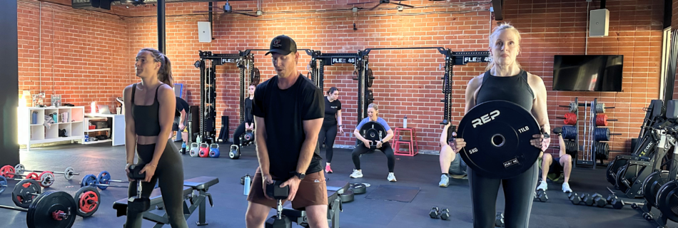 Coach-led group workout at a boutique fitness studio in Thousand Oaks